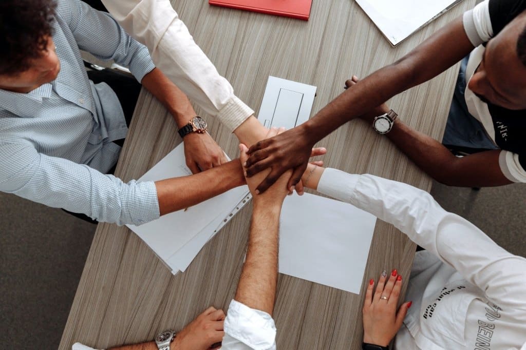 hands on top of each other, company reputation